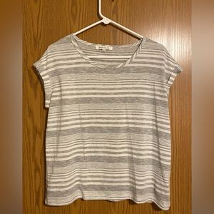 Gray and white striped loose fitting top.